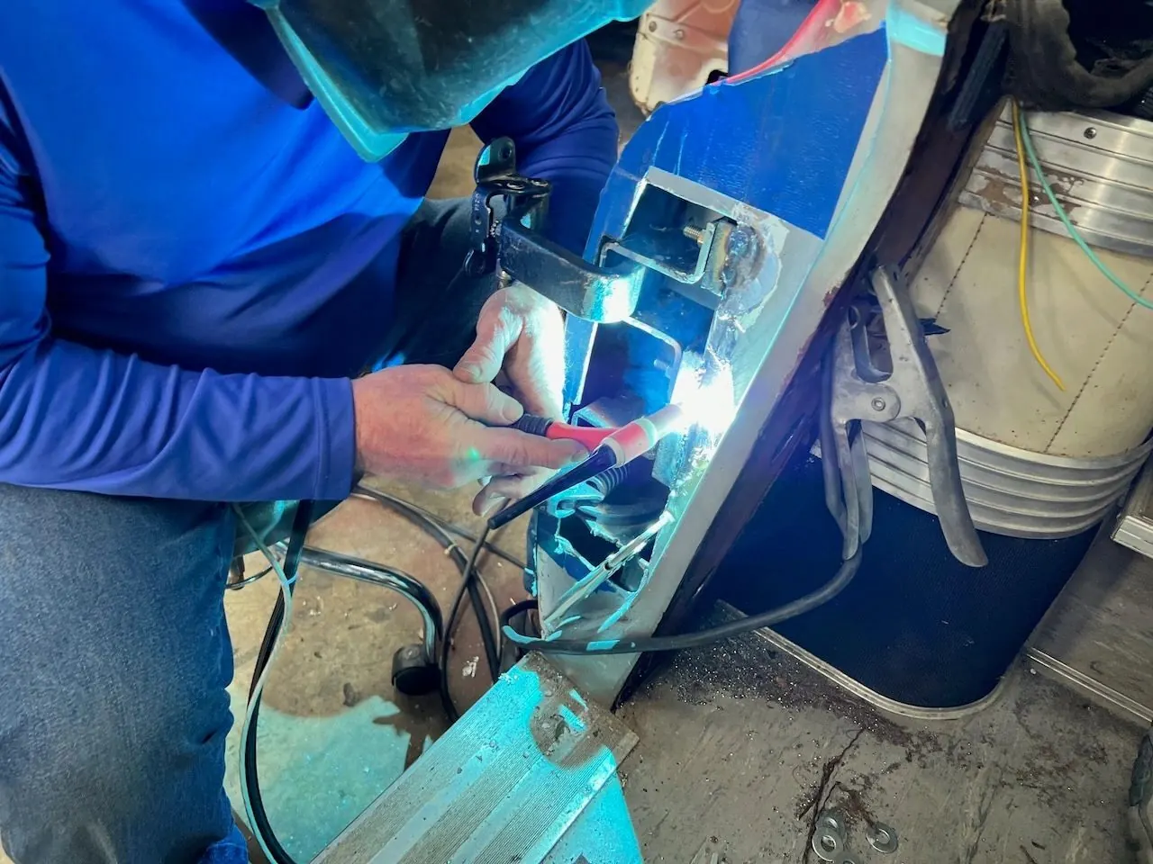 Welding the hinge bracket into the door frame