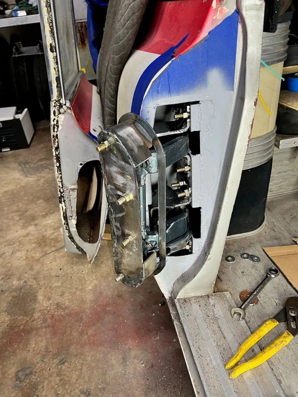 The hinge pocket welded into the door