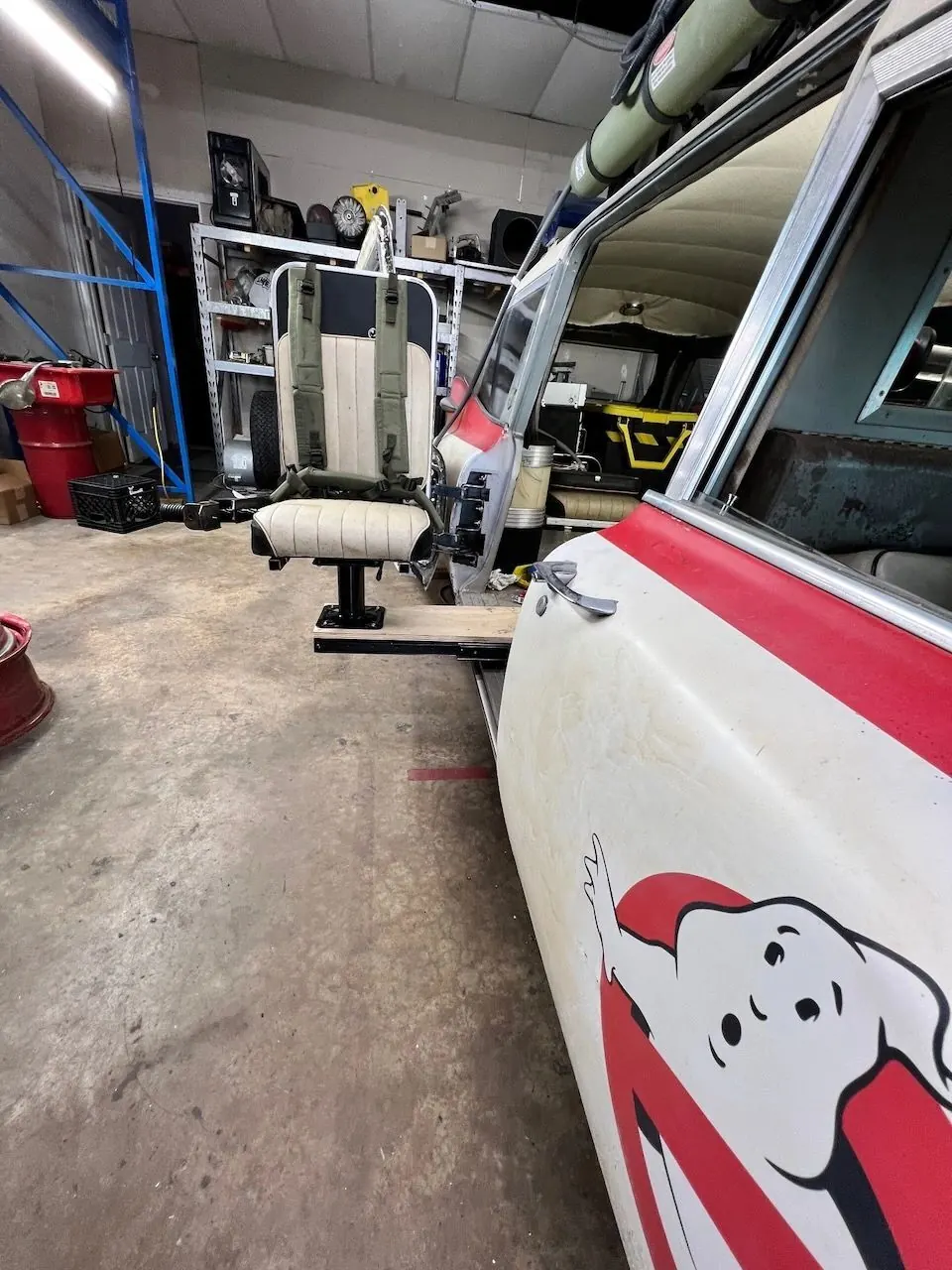 Seat installed behind the open door