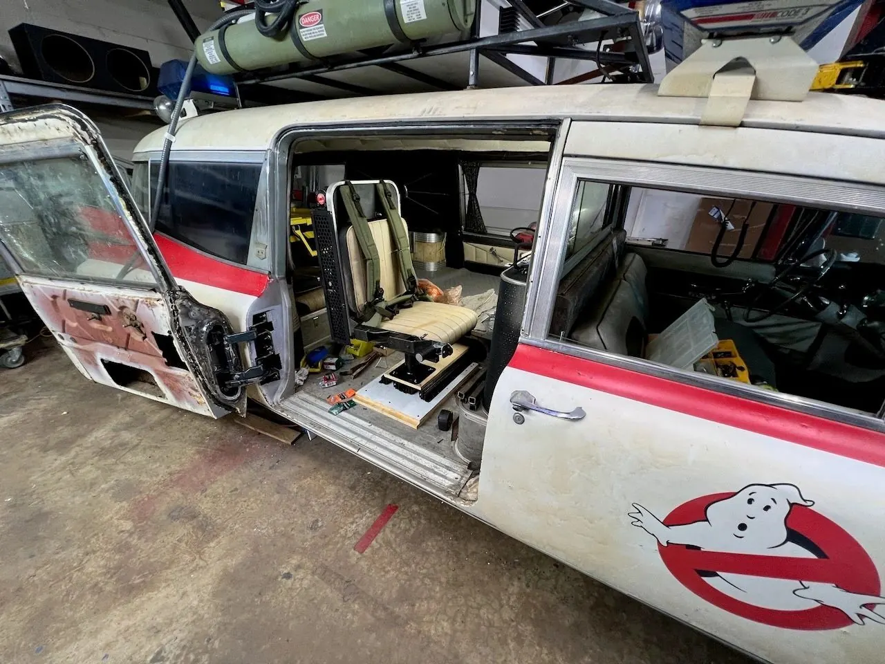 The seat and pack seen through the open door