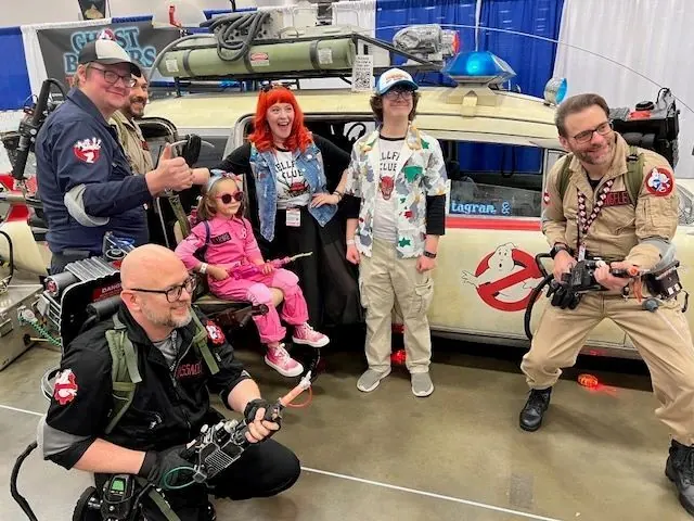 Ghostbusters fans posing with Ecto-TX at FanExpo Dallas