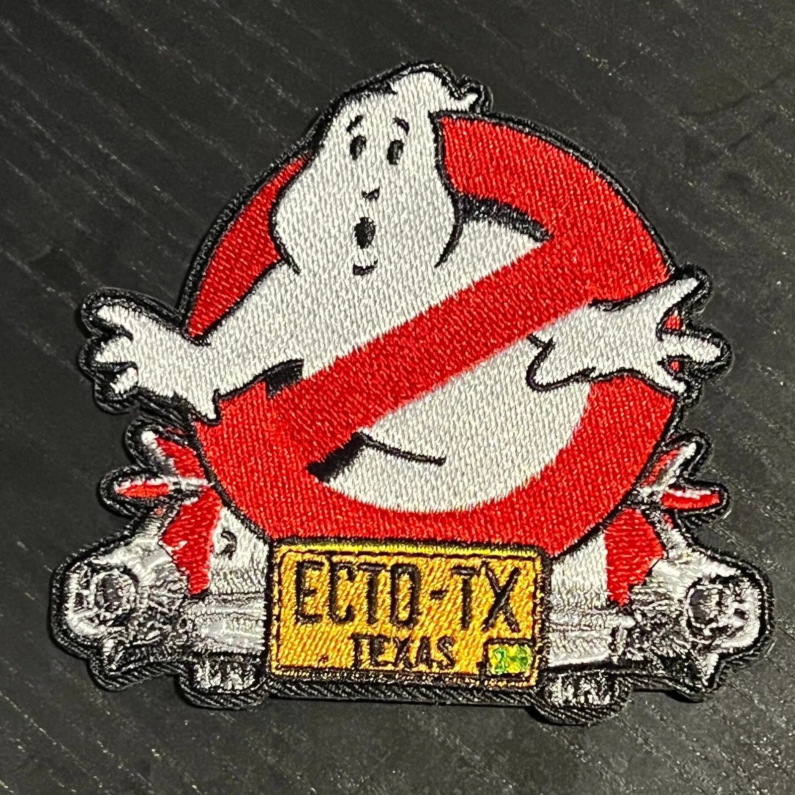 Embroidered EctoTX logo iron-on patch